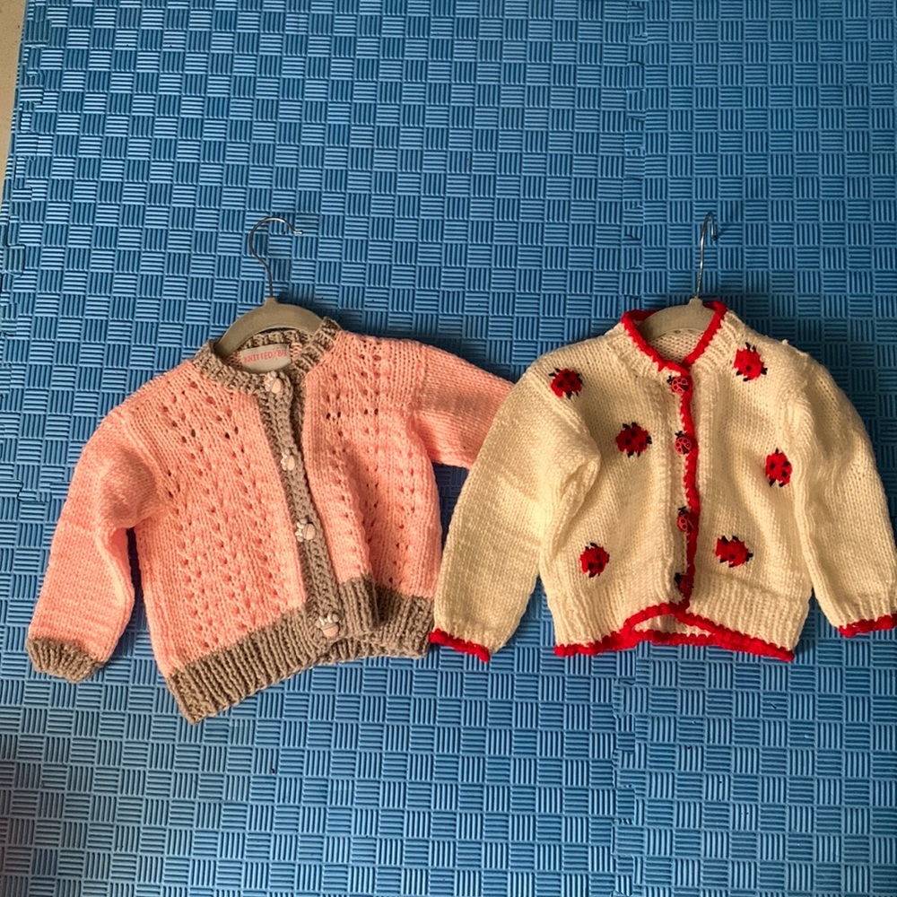 Two hand made little toddler “Knitted By” Sweaters, 18-24 mos.  Little girl